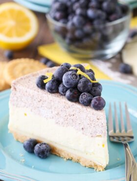 Slice of Lemon Blueberry Mousse cake on a blue plate