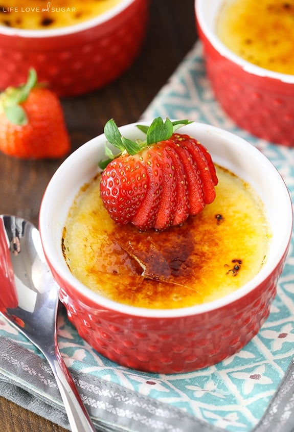 Strawberries Brûlée in a red ramekin