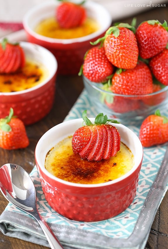 Strawberries Brûlée in red ramekins