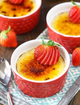 overhead view of Strawberries Brûlée in red ramekins