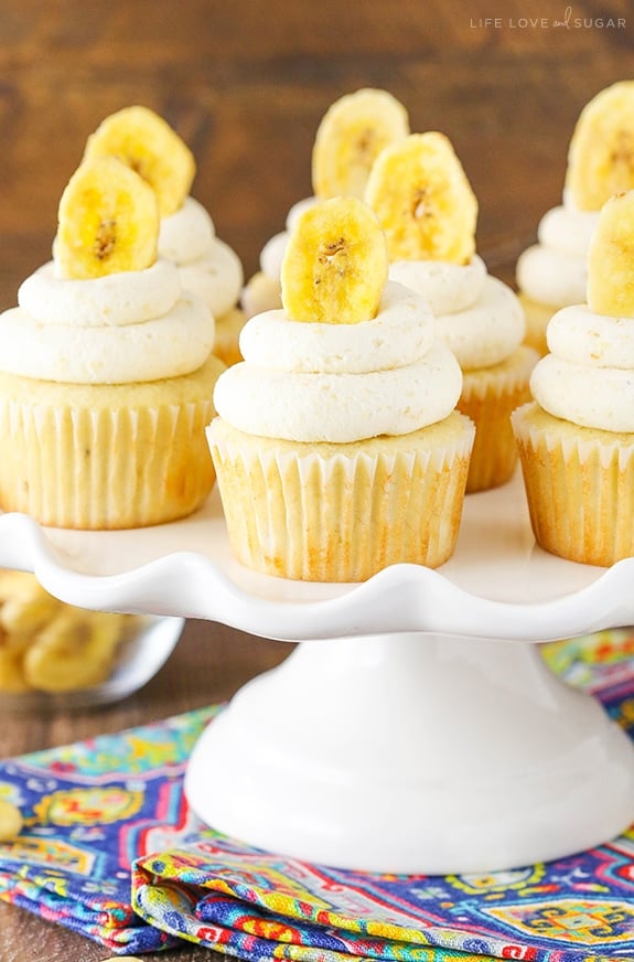 Banana Cream Pie Cupcakes - Banana cupcakes, cream pie filling and an amazing banana frosting with a special ingredient! Seriously to die for!