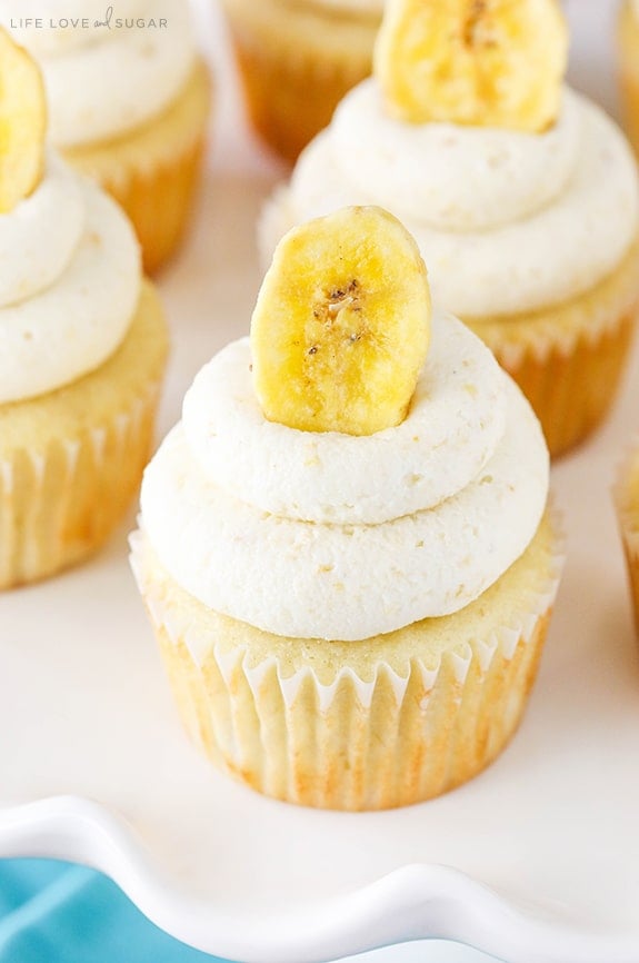 Overhead close-up view of Banana Cream Pie Cupcakes on a cake stand