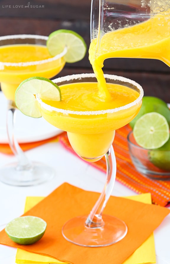 Pitcher pouring perfect Mango Margaritas