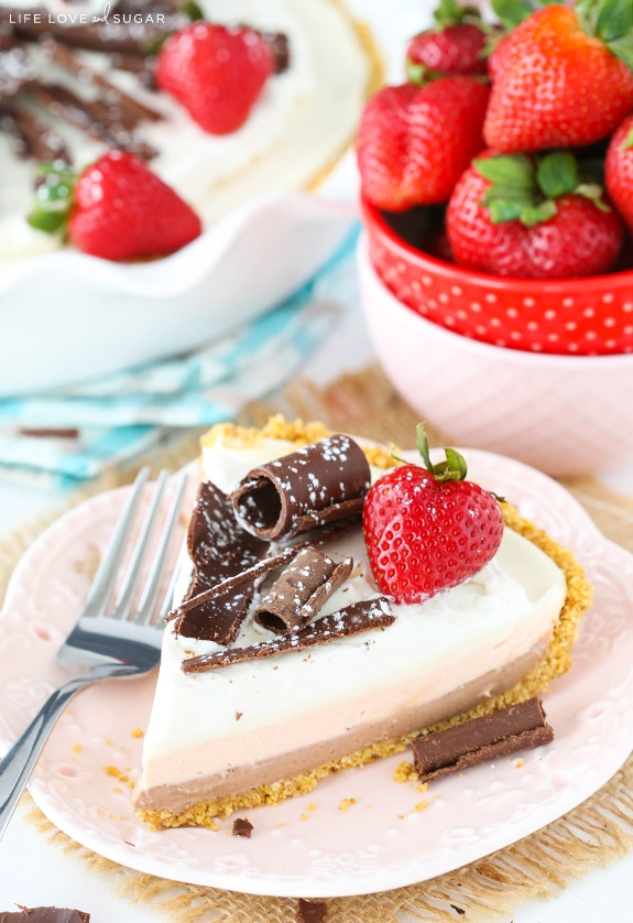 A slice of No Bake Neopolitan Cheesecake Pie on a plate