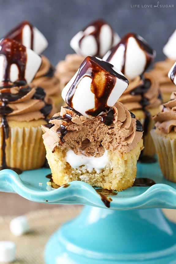 Nutella Fluffernutter Cupcakes on a cake stand with a bite out of one