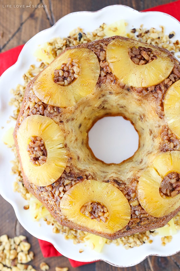 Top view of a whole Pineapple Walnut Upside Down Bundt Cake on a white platter