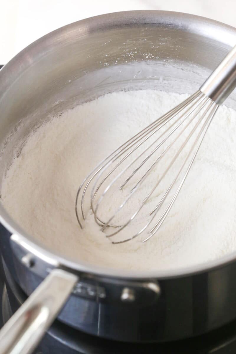 Whisking cornstarch, sugar, and salt.