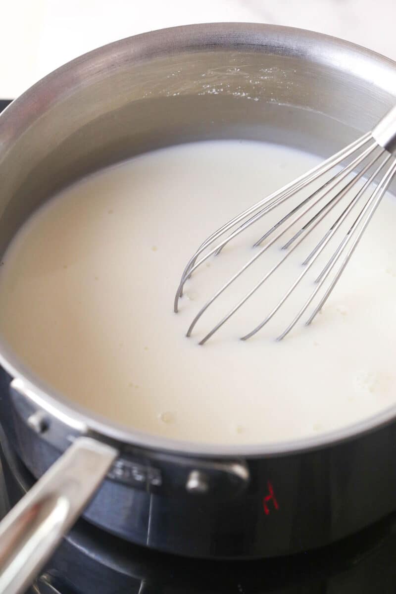Whisking milk into the cornstarch mixture