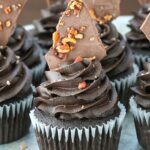 close up of Smokey Bourbon Chocolate Cupcakes with Bacon