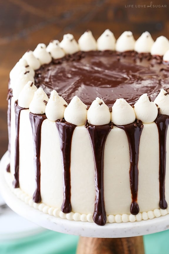 A baileys cake with white frosting and chocolate ganache