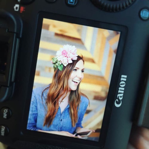 An Image on Lindsay's Camera Screen of a Girl with Flowers in Her Hair