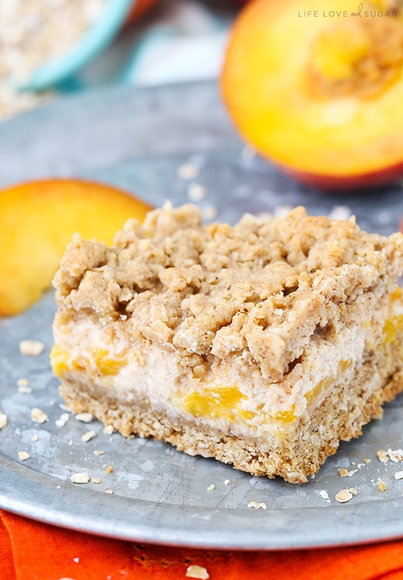 Peach Cinnamon Oatmeal Cheesecake Bar on a metal plate