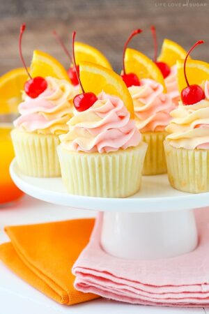 Tequila Sunrise Cupcakes on cake stand