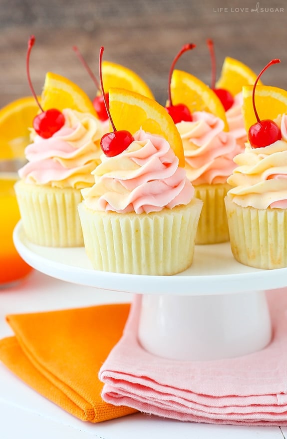 Tequila Sunrise Cupcakes on a cake stand