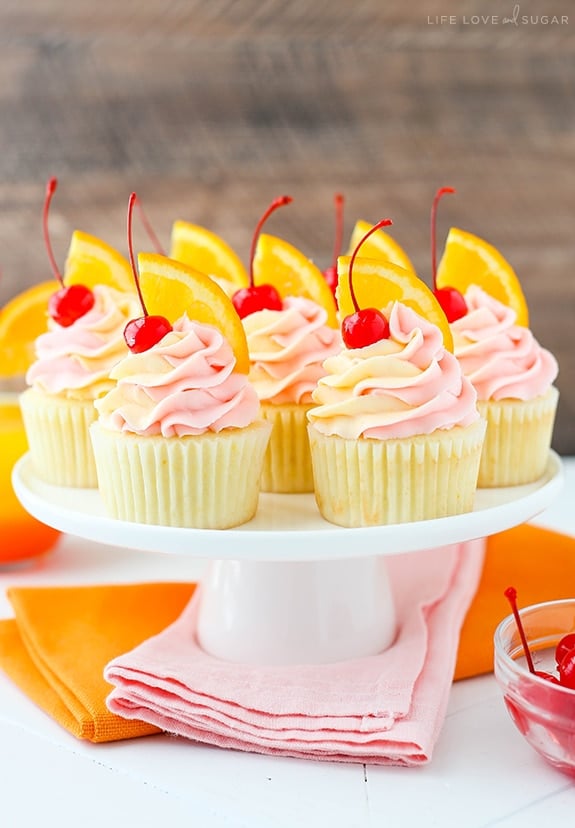 Tequila Sunrise Cupcakes on a cake stand