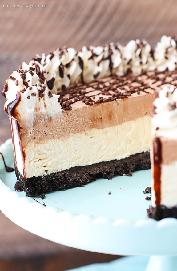 Frozen Irish Cream Mousse Cake on a cake stand with a slice removed