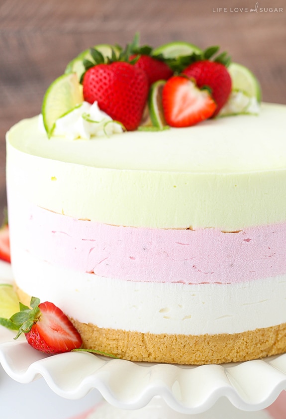 Side view of Key Lime Strawberry Coconut Ice Cream Cake on a cake stand