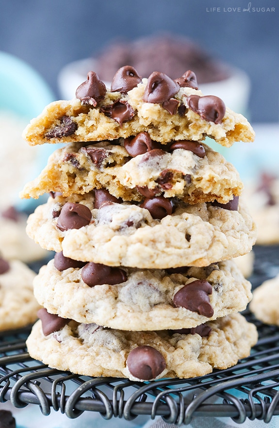 Oatmeal Chocolate Chip Cookies stacked on a cooling rack