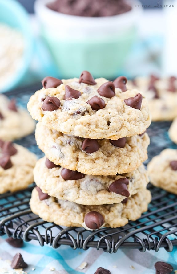 Oatmeal Chocolate Chip Cookies stacked on a cooling rack