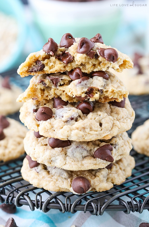 Oatmeal Chocolate Chip Cookies stacked on a cooling rack