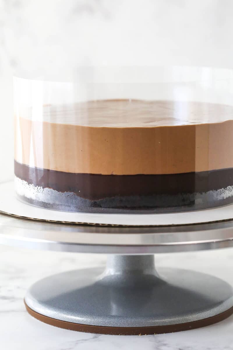 Chocolate mousse spread on top of chocolate cake