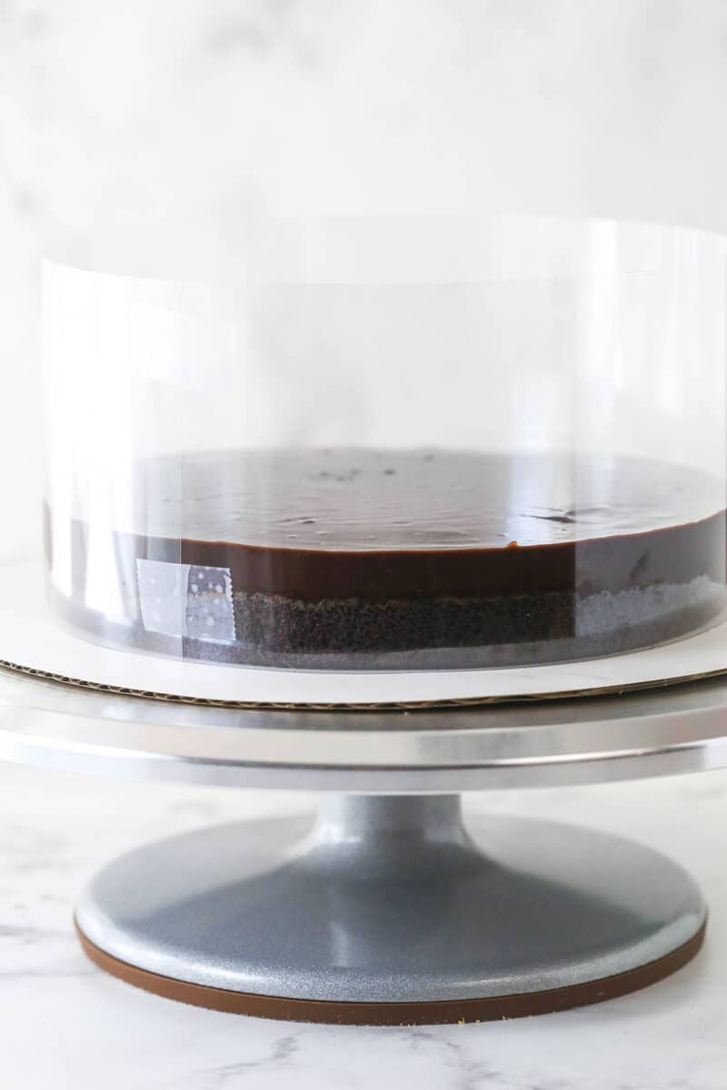 Chocolate ganache spread over chocolate cake