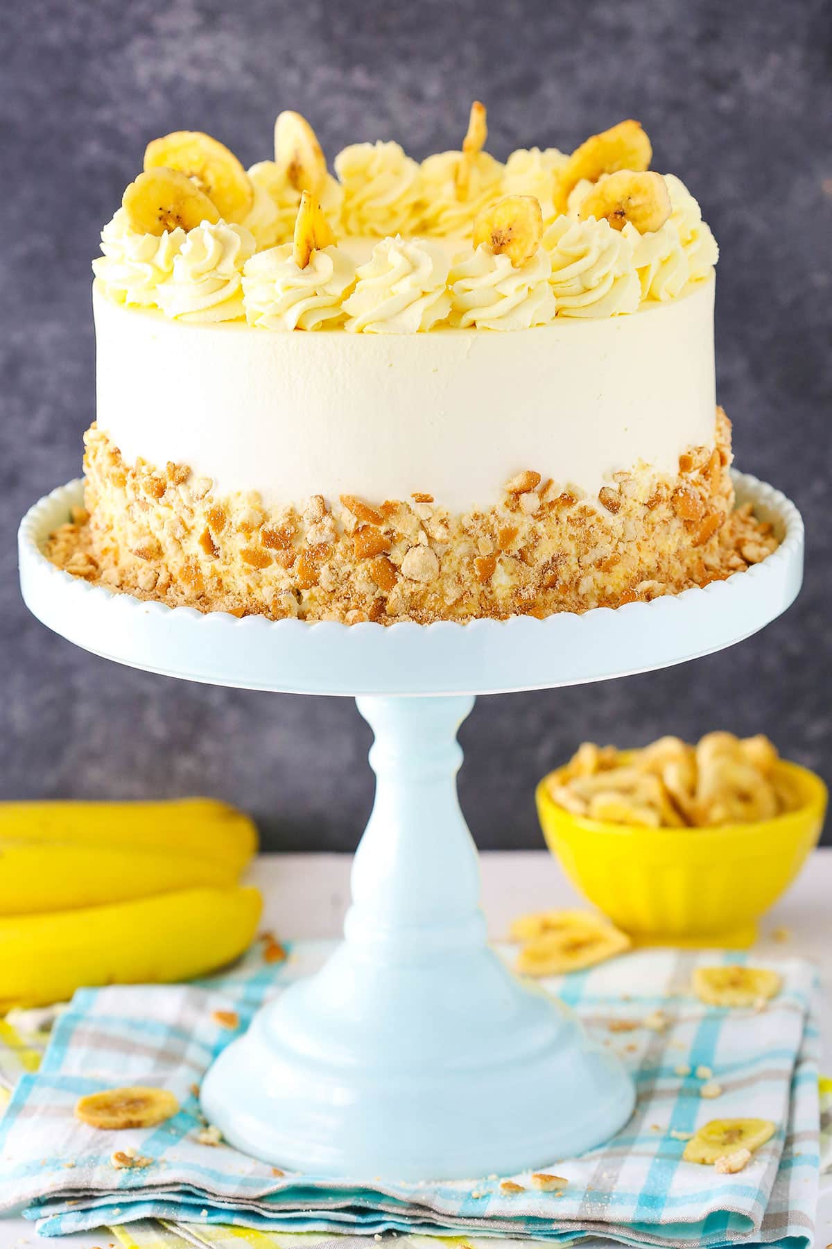 Banana ice cream cake on a stand.