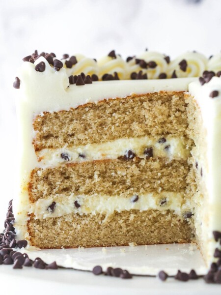 Cannoli layer cake with a slice missing