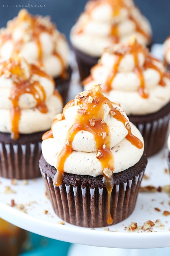 Chocolate Turtle Cupcakes on a cake stand