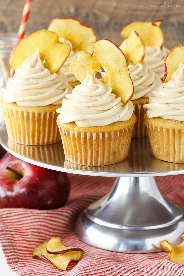 Apple Cupcakes topped with frosting and apple chips on a silver cake stand