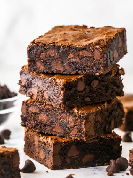 Four fudgy brownies stacked on each other