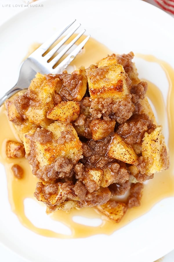 A serving of French Toast Breakfast Casserole on a white plate with a fork