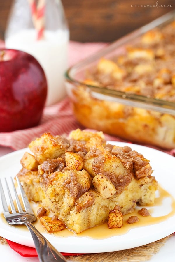 A piece of French Toast Casserole on white plate with a fork