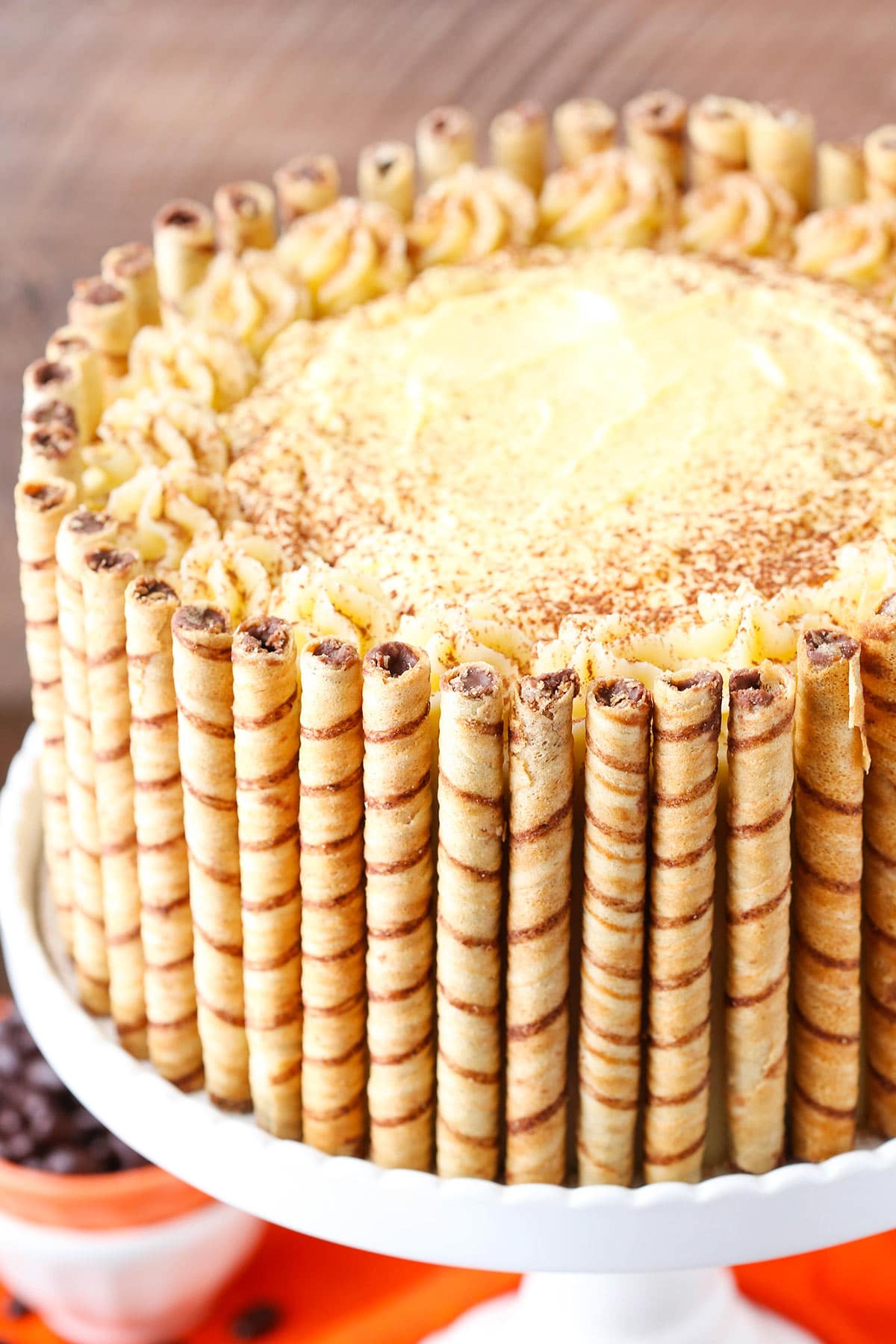 Overhead view of Pumpkin Tiramisu Layer Cake on a cake stand.