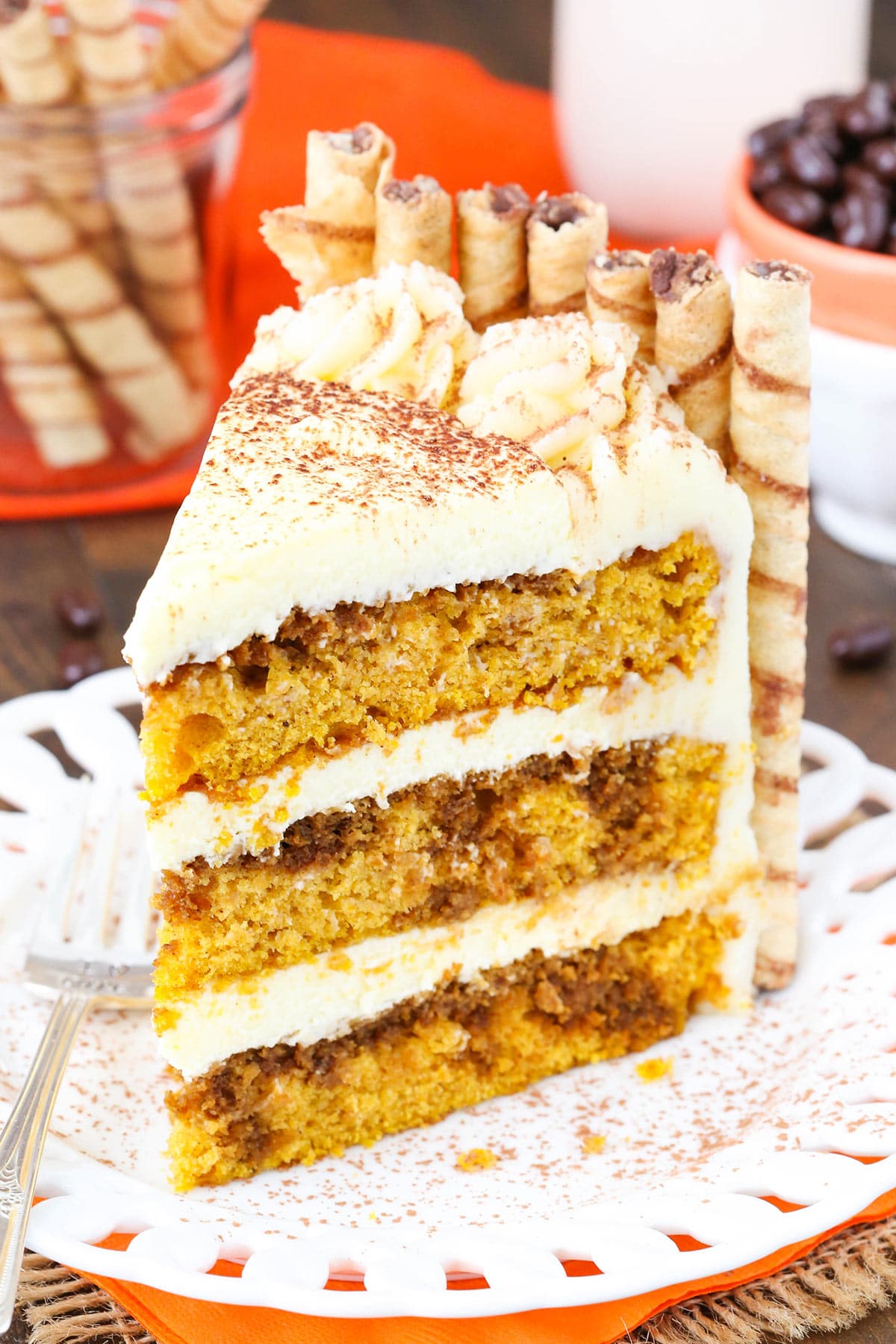 A slice of pumpkin layer cake with tiramisu filling.