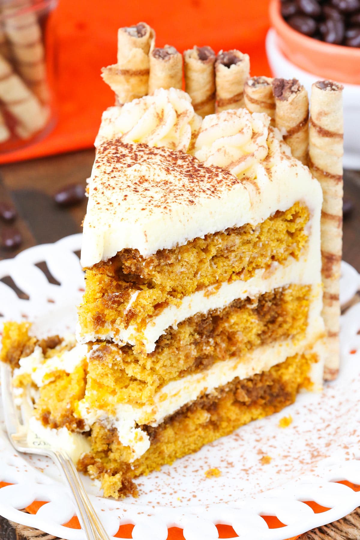 Slice of Pumpkin Tiramisu Layer Cake with a bite taken out.