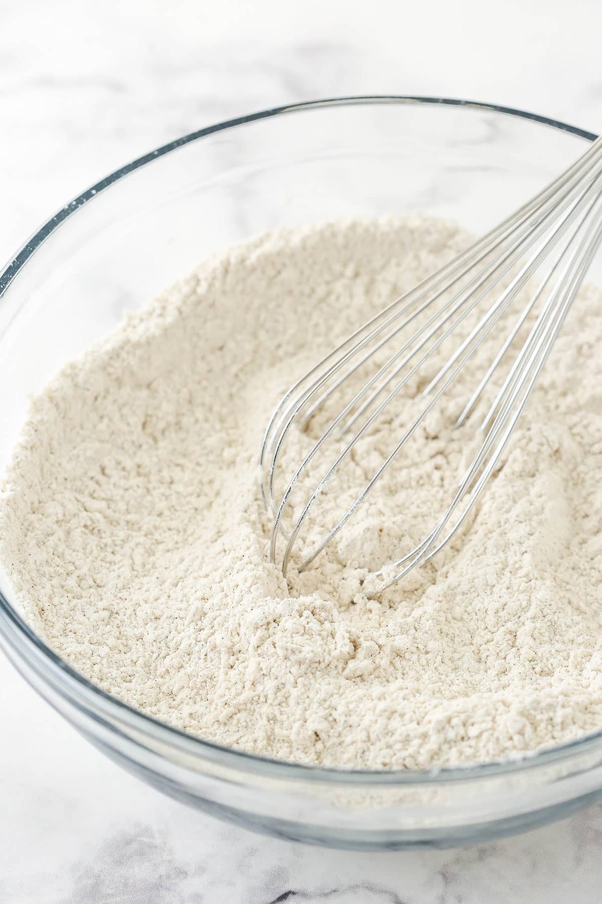 The dry ingredients whisked together in glass bowl.