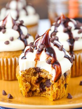 image of Pumpkin Chocolate Chip Cupcakes with Cream Cheese Frosting with bite taken out