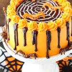 Spiderweb Chocolate Cake with Vanilla Frosting on white cake stand