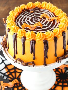 Spiderweb Chocolate Cake with Vanilla Frosting on white cake stand