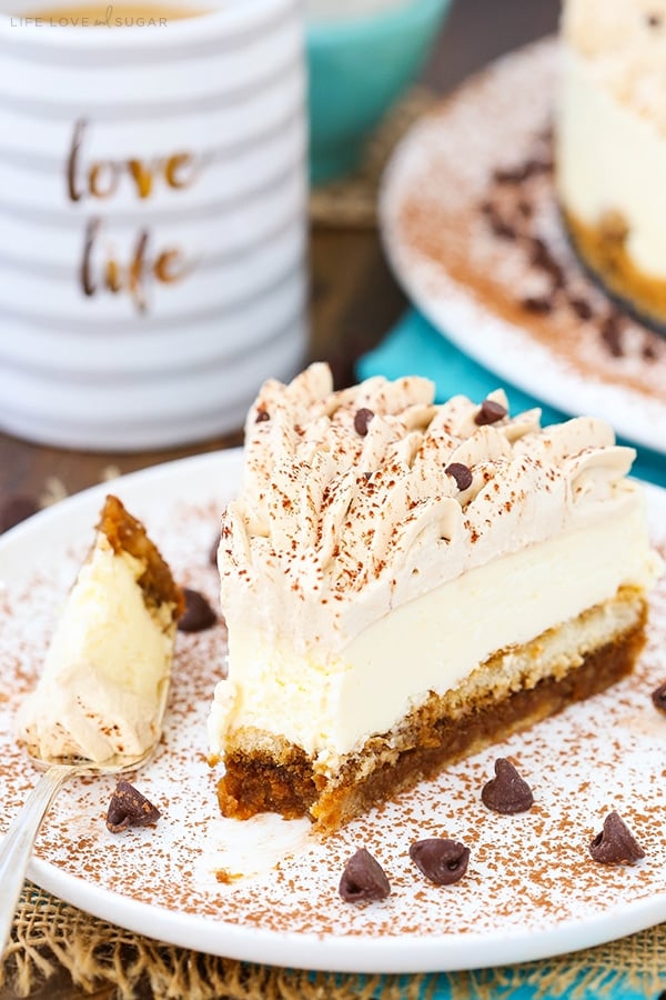 A slice of tiramisu cheesecake with a bite taken out