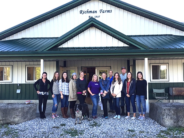 Twelve Bloggers Lined Up Outside the Entrance to Richman Farms