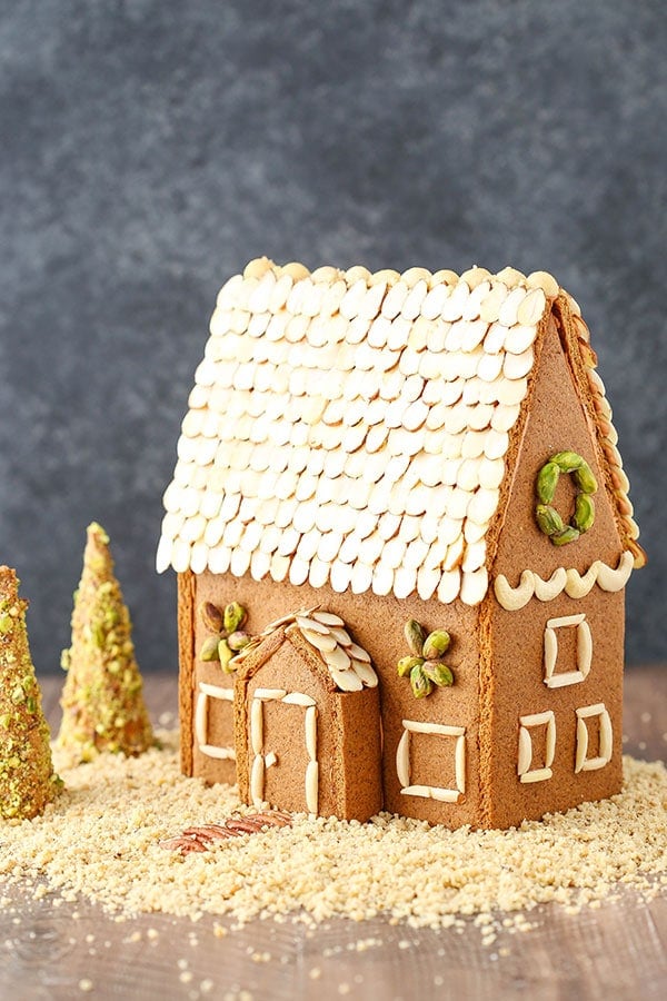 A gingerbread house made form scratch out of cookies and nuts