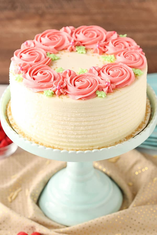 Raspberry Almond Layer Cake! Such a light, moist cake with fresh raspberry frosting!