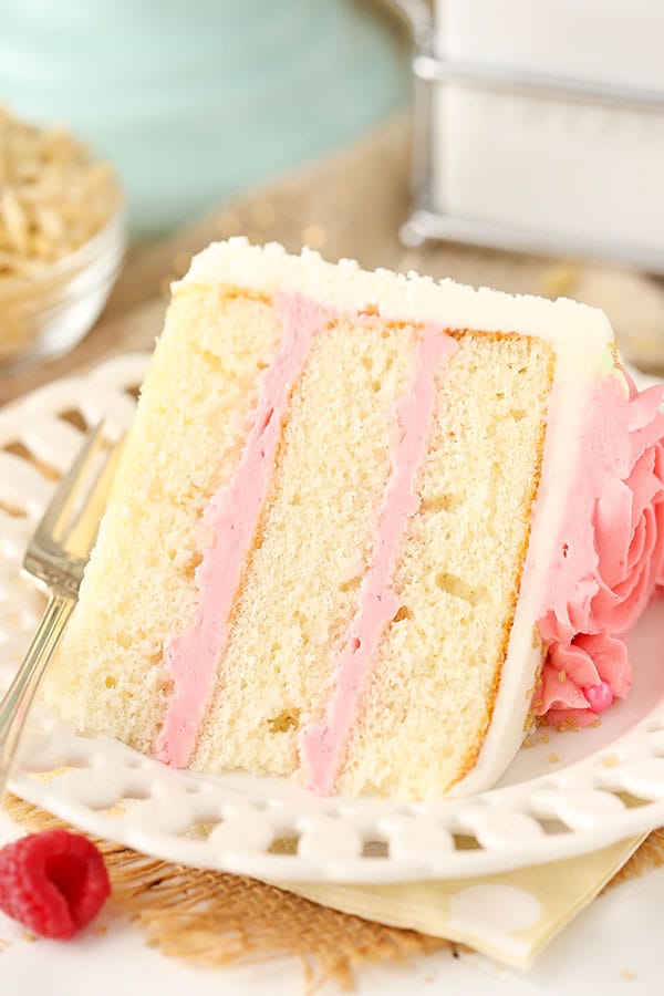 Raspberry Almond Layer Cake! Such a light, moist cake with fresh raspberry frosting!