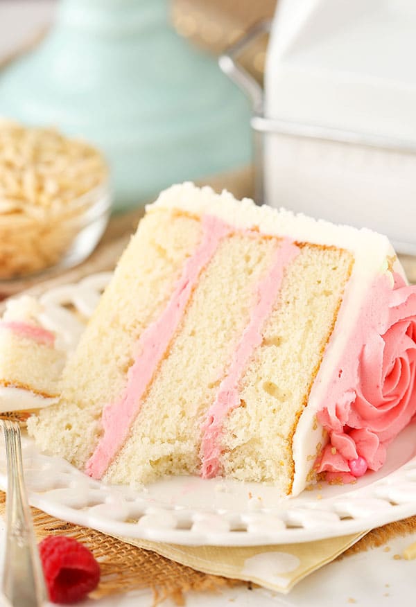 Raspberry Almond Layer Cake! Such a light, moist cake with fresh raspberry frosting!