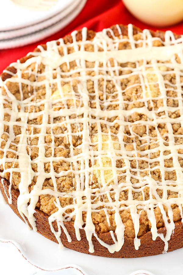 Eggnog coffee cake with crumb topping on a plate.