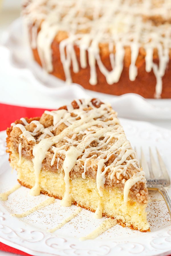 Slice of eggnog crumb cake on a white plate.