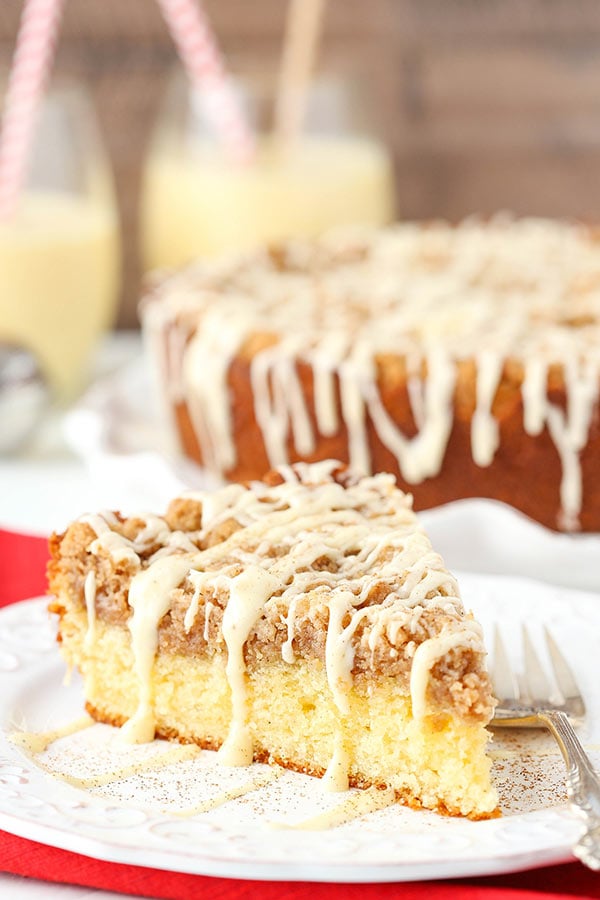 Slice of eggnog crumb cake on a white plate.