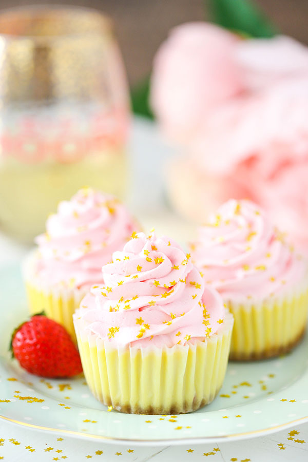 Mini Strawberry Champagne Cheesecakes - lots of champagne and strawberry flavor! Perfect for New Years Eve!